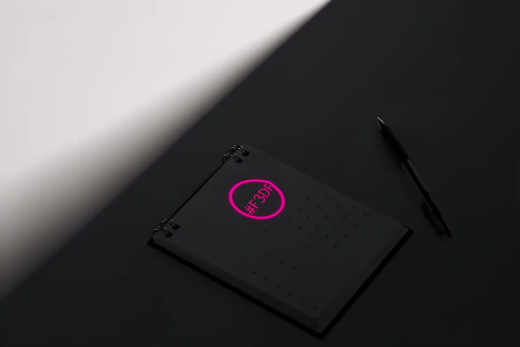 A year planner on a dark surface with one date circled in coral.