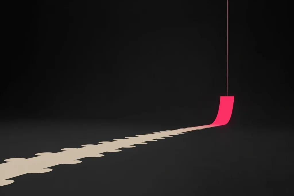 A falling graph turning back up in coral on a dark surface.