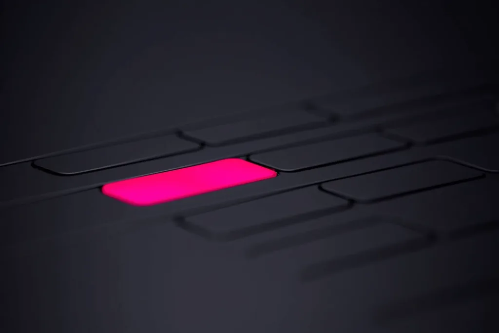 Many faint search bars with one glowing coral search bar in focus on a dark surface.