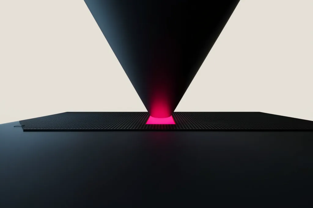 A glowing funnel narrowing to a coral base on a dark surface.